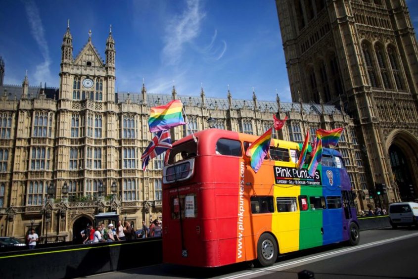 Gay campaigners celebrate outside the Houses of Parliament in London. AFP: Andrew Cowie