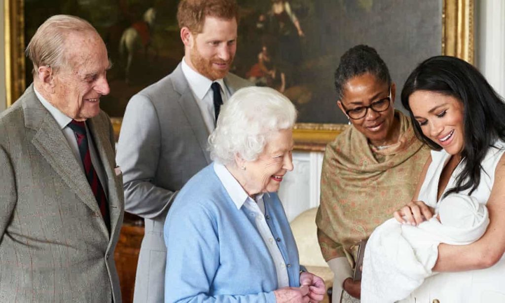 The Queen and Duke of Edinburgh meet royal baby Archie, held by Meghan as Prince Harry and Meghan’s mother, Doria Ragland, look on. Photograph: Chris allerton/Sussex Royal/Twitter