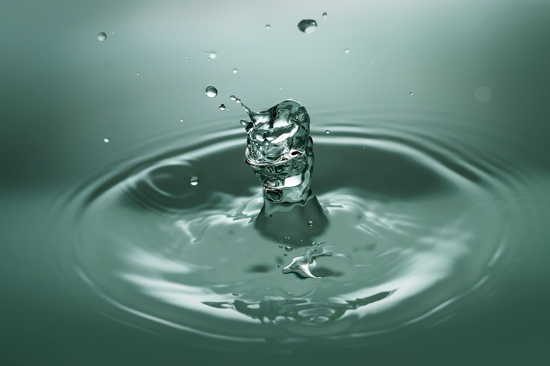 close up of drop splashing in water