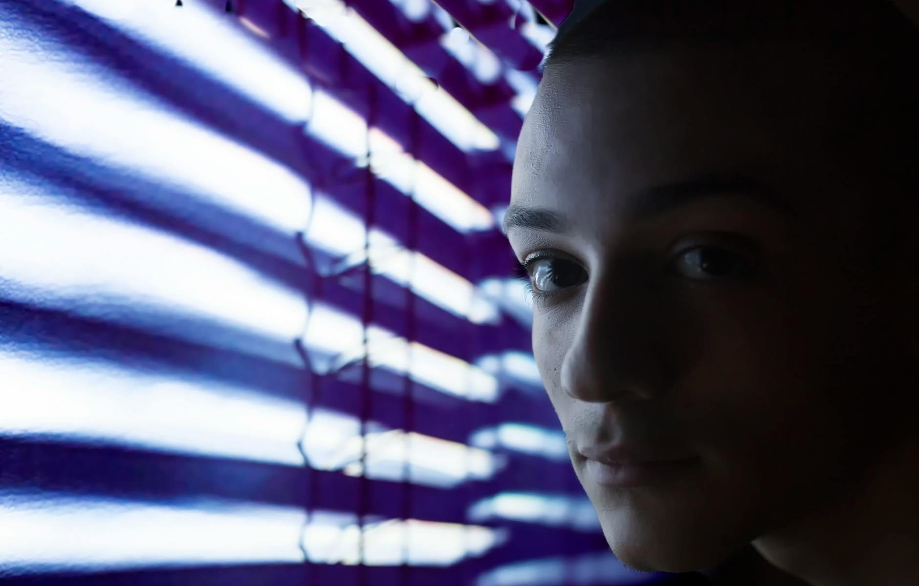 close up photo of person near neon lights