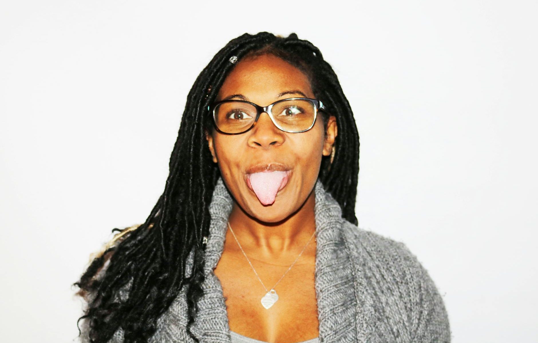 photography of woman showing her tongue
