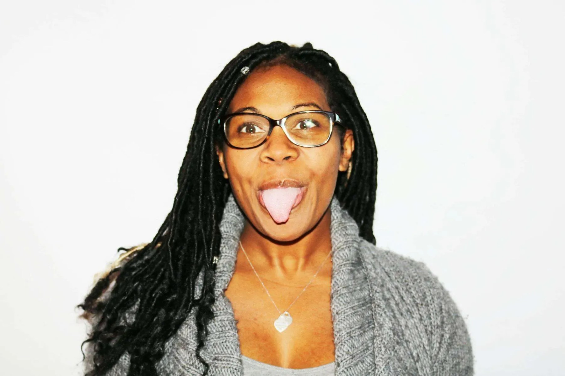 photography of woman showing her tongue