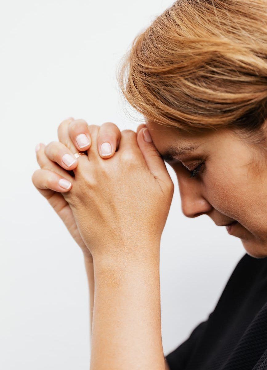 close up shot of a woman praying